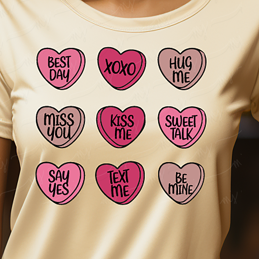 a woman wearing a t - shirt with a bunch of hearts on it