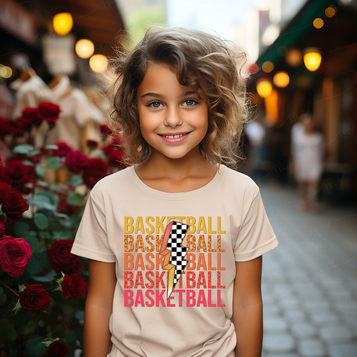 a little girl that is standing in front of flowers