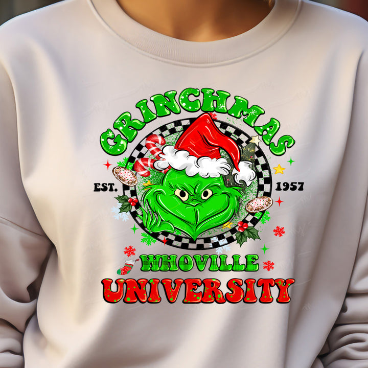 a person wearing a white sweatshirt with a green grin face on it