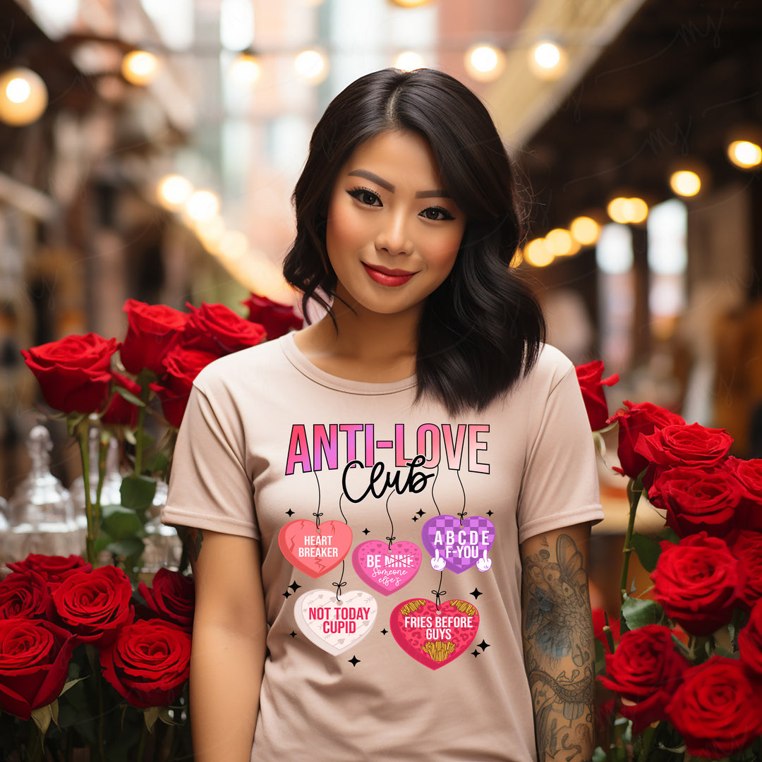 a woman standing in front of a bunch of red roses