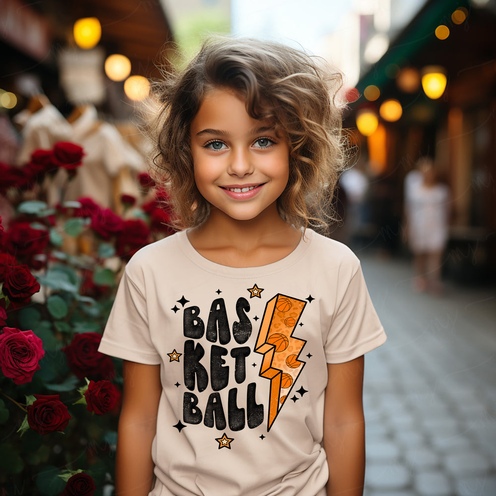 a little girl that is standing in front of a rose bush