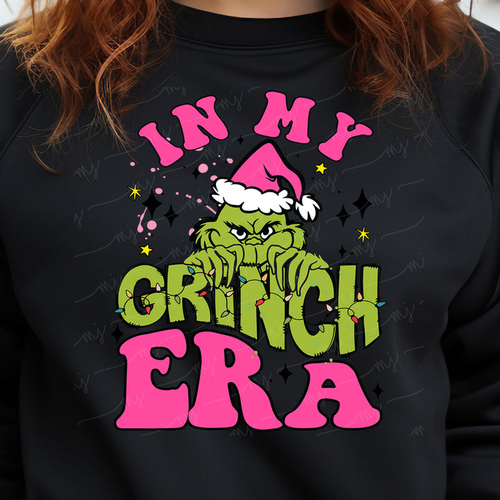 a woman wearing a black sweatshirt that says in my grin era