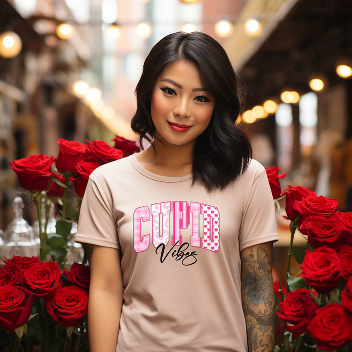 a woman standing next to a bunch of red roses