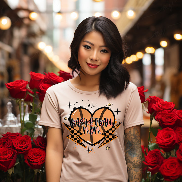a woman standing in front of a bunch of roses