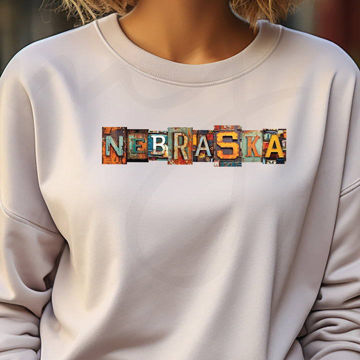 a woman wearing a white sweatshirt with the word nebraska printed on it