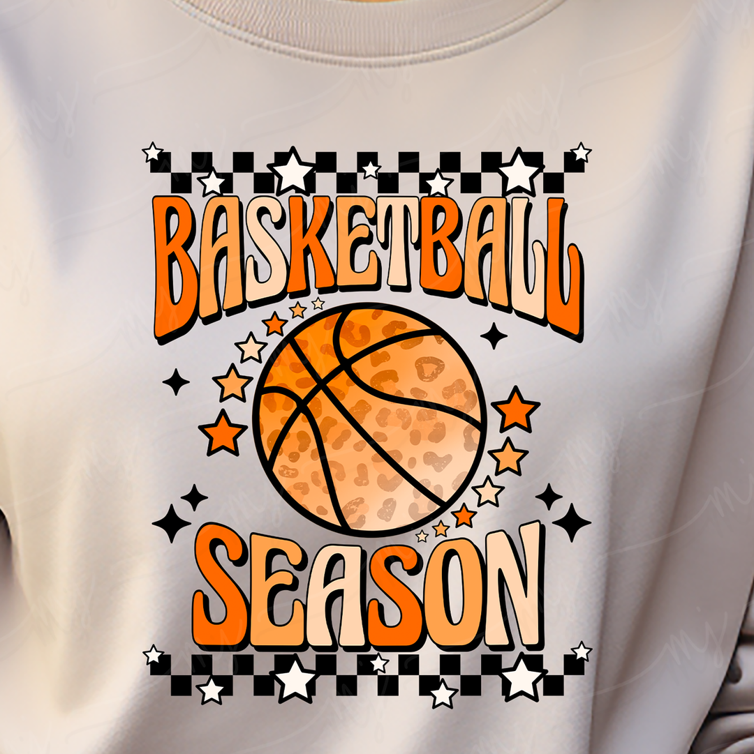 a person wearing a white shirt with an orange basketball on it