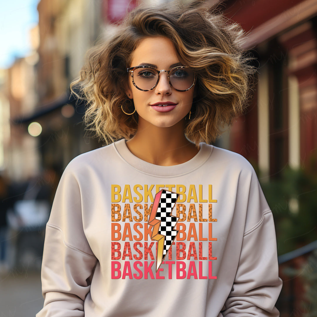 a woman wearing a sweatshirt that says basketball