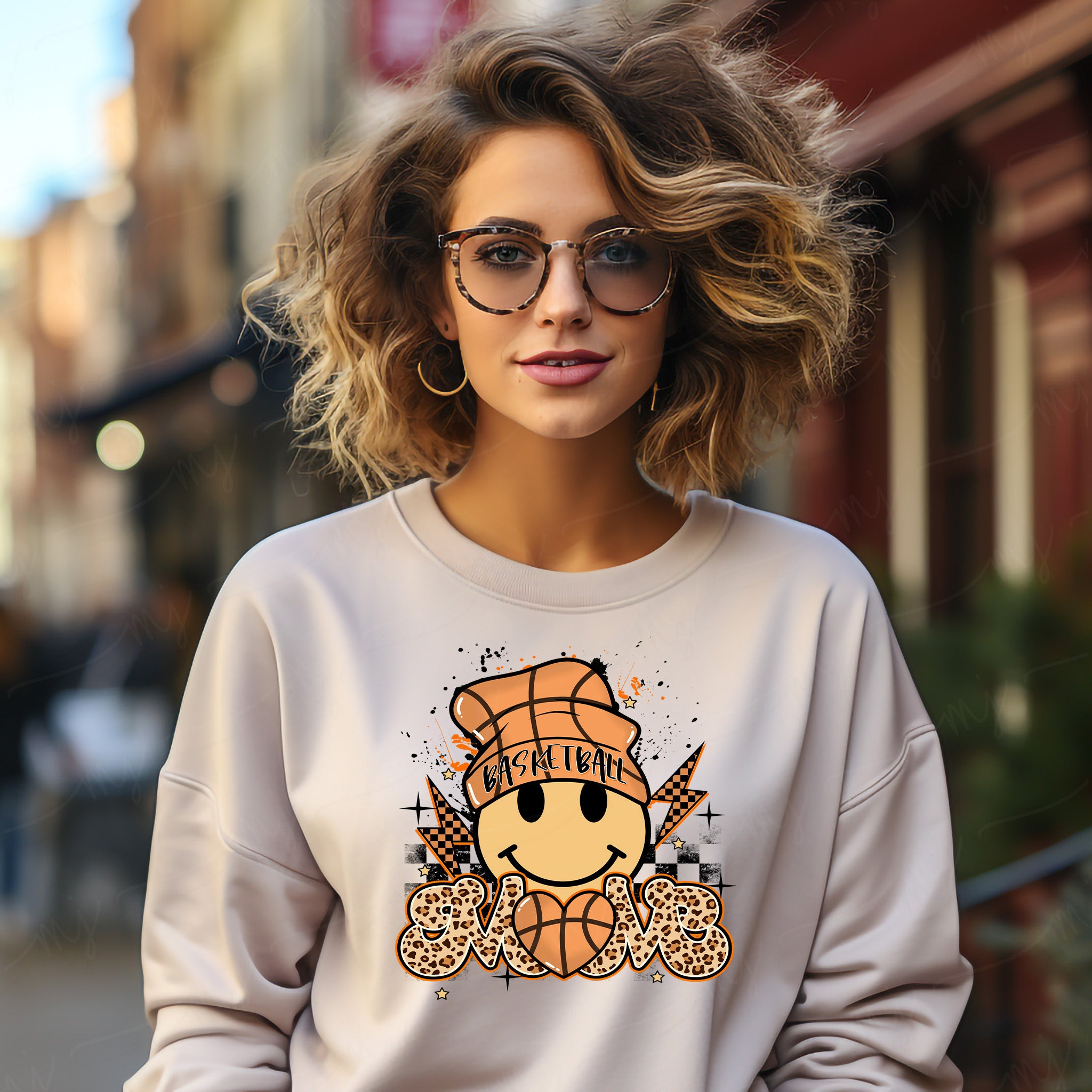 a woman wearing a sweatshirt with a smiley face on it