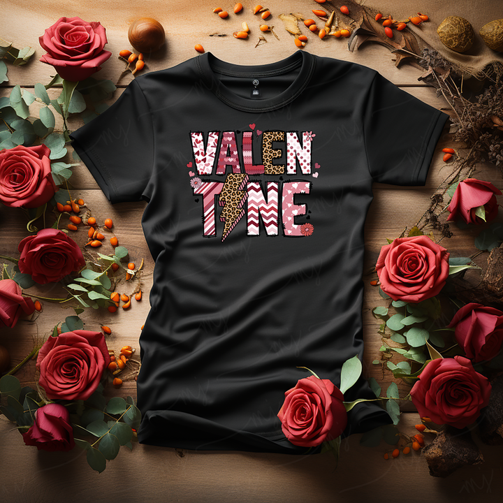 a black t - shirt with a cross on it surrounded by roses